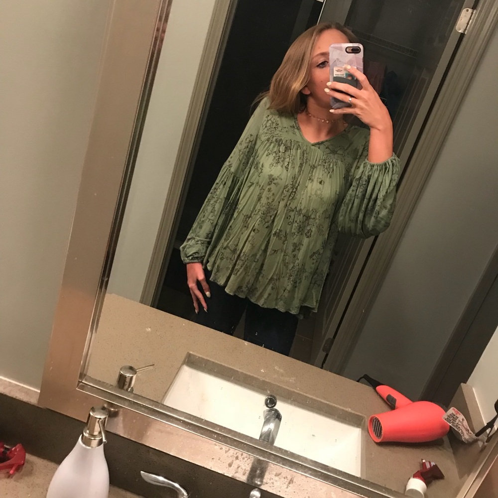 green flowy top w floral design from altar’d state